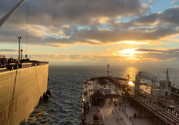 Two huge ships next to each other in the ocean